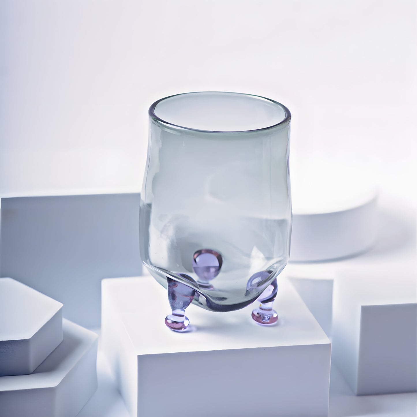 Eye Candy Cocktail Glass with a modern design featuring a translucent body and unique purple bubble-like feet, perfect for stylish drinkware.