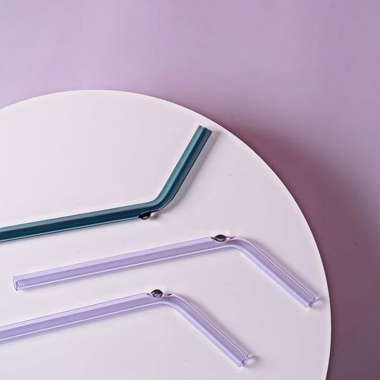 Set of three Doté Glass Straws in pastel and deep hues, featuring sleek intersecting circular designs. A sophisticated addition to any drinkware collection.