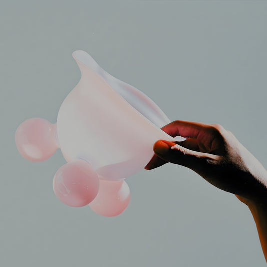 Candy Bowl in Pastel Milky Pink – A delicate, hand-blown borosilicate glass bowl with a soft, dreamy pink hue. Its smooth, rounded form and subtle opacity create a playful yet elegant presence, perfect for serving treats or adorning a tabletop.