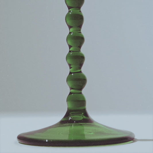 Close-up of the green stem of the Martini Glass duo from the Teta Edition, showcasing its handcrafted, modern barware design.